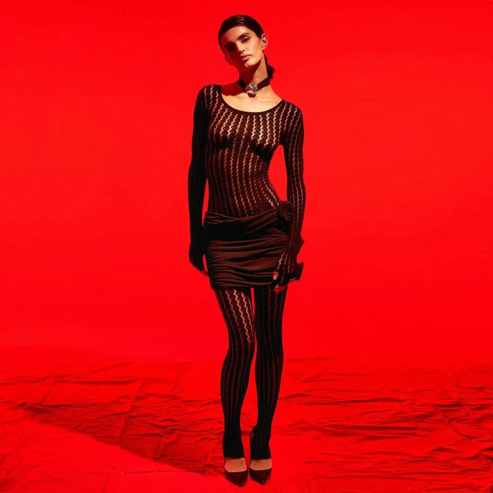 All-black one-piece jumpsuit with stretchy see-through jacquard fabric and bodycon cut
