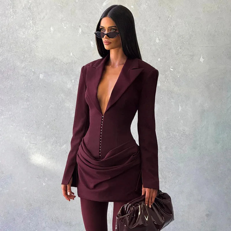Burgundy mini dress with plunging neckline, structured shoulders, and draped high-waist skirt
