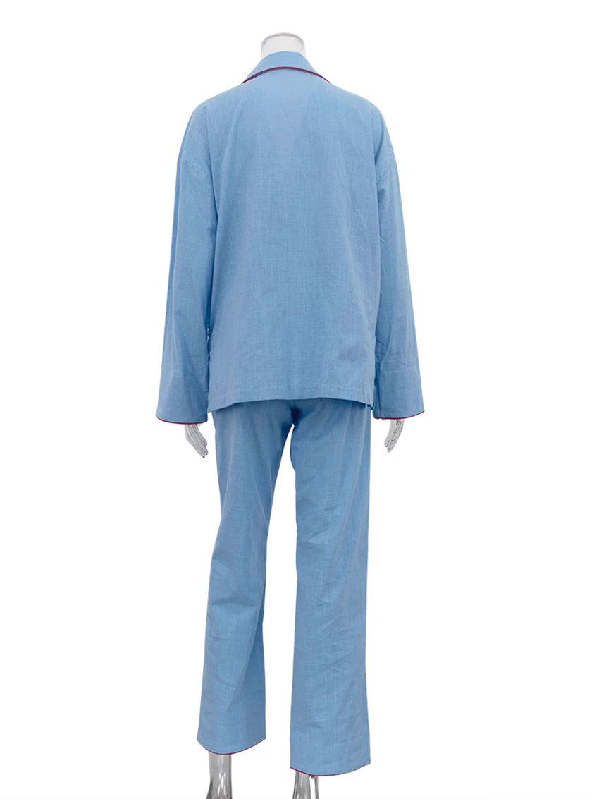Light blue suit on a mannequin against a white background