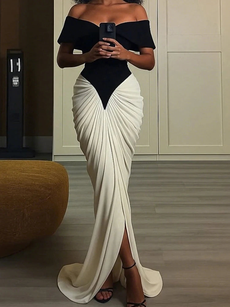 Elegant patchwork evening dress with off-shoulder neckline and fitted waist
