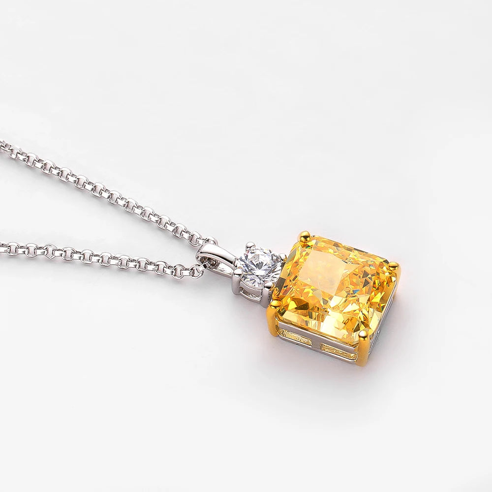 Yellow gemstone pendant on a white background