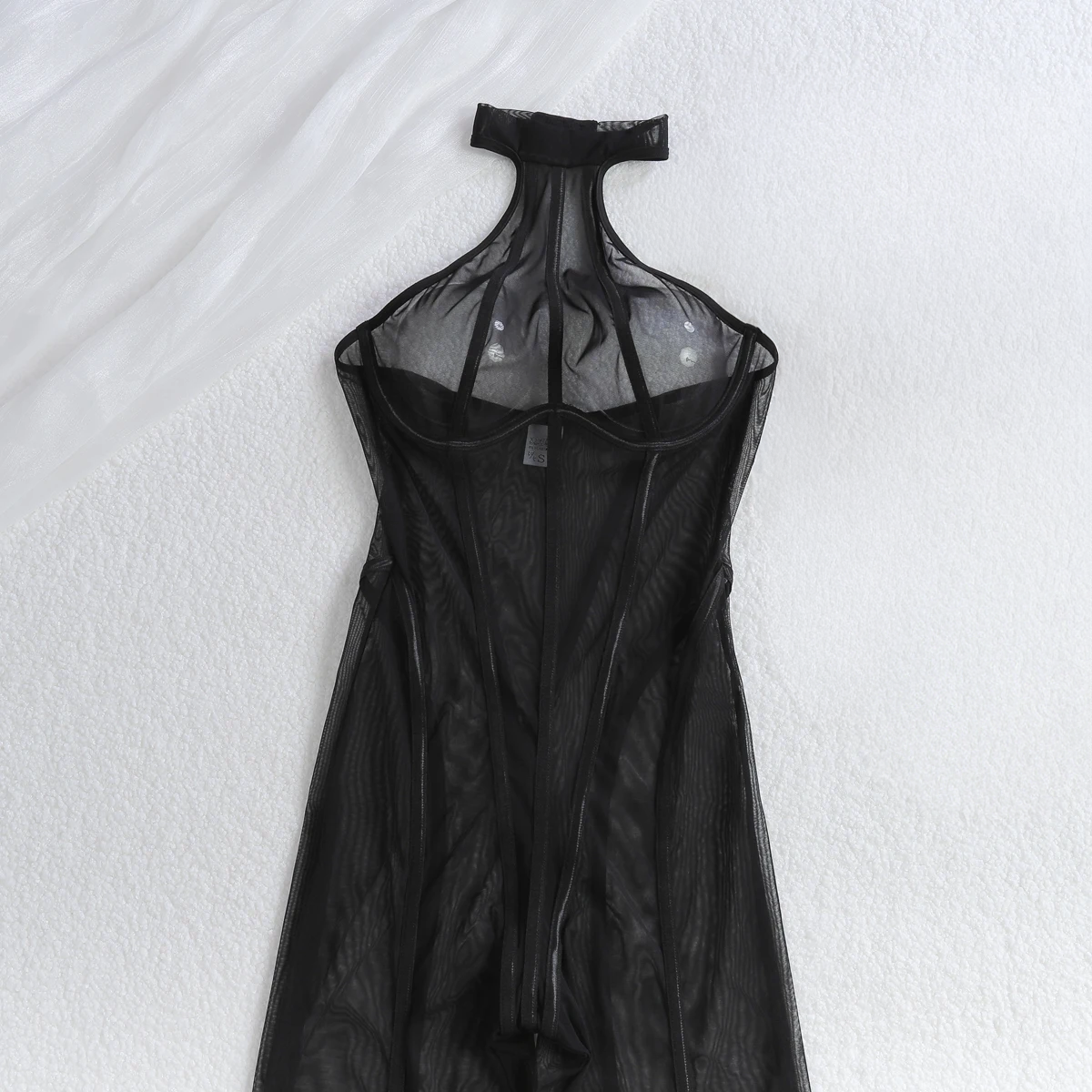 One-piece black sheer striped jumpsuit with elongated slimming effect
