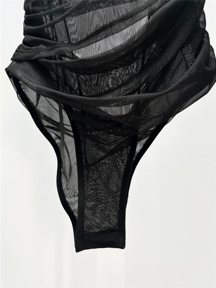 Black lace lingerie set on a white background