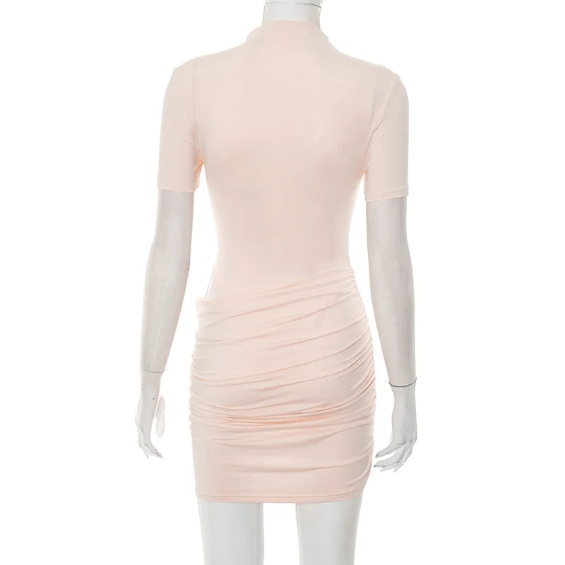 Light pink dress on a mannequin against a white background