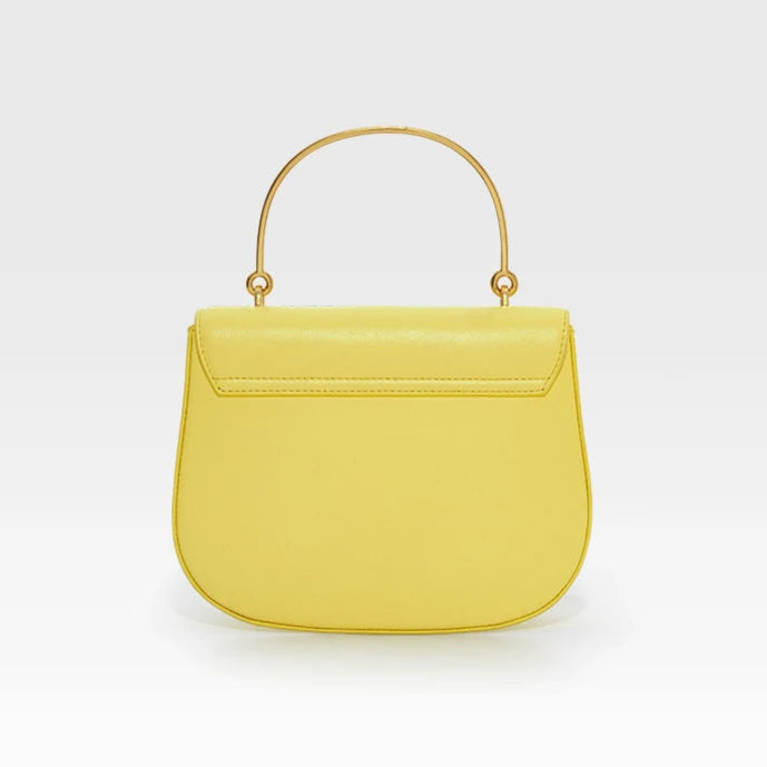 Yellow handbag with gold handle on a white background, featuring the brand 'Bafelli'.