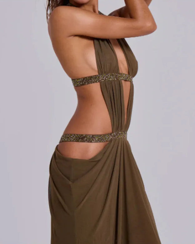 Brown evening gown with cut-out design on a plain background