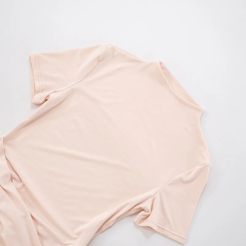 Light pink tank top on a light gray background