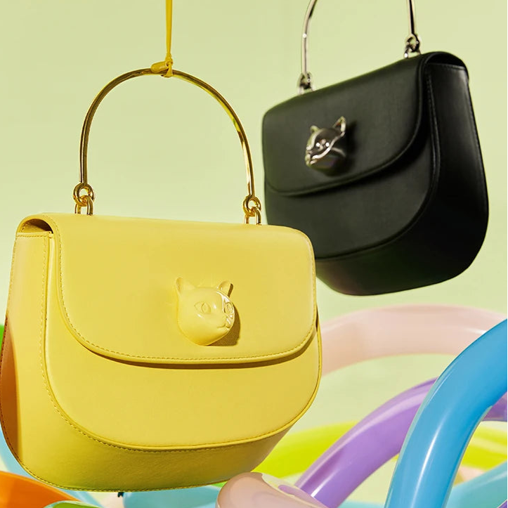 Two handbags, one yellow and one black, hanging against a colorful background with 'Bafelli' branding.