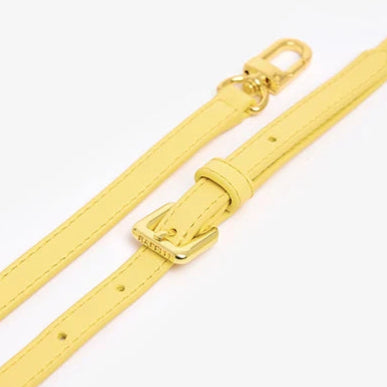 Yellow belt with a buckle on a white background