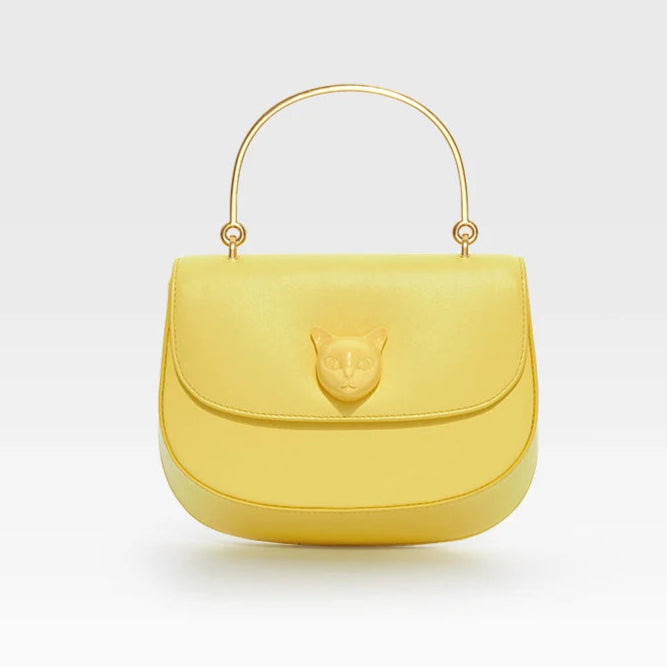 Yellow handbag with a gold handle on a light gray background, featuring the brand 'Bafelli'.