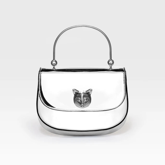Silver handbag with a cat face emblem on a white background, featuring the brand 'Bafelli'.