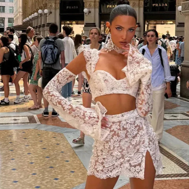 Sexy white lace co-ord set with long sleeve crop top and high slit skirt for vacation or party look