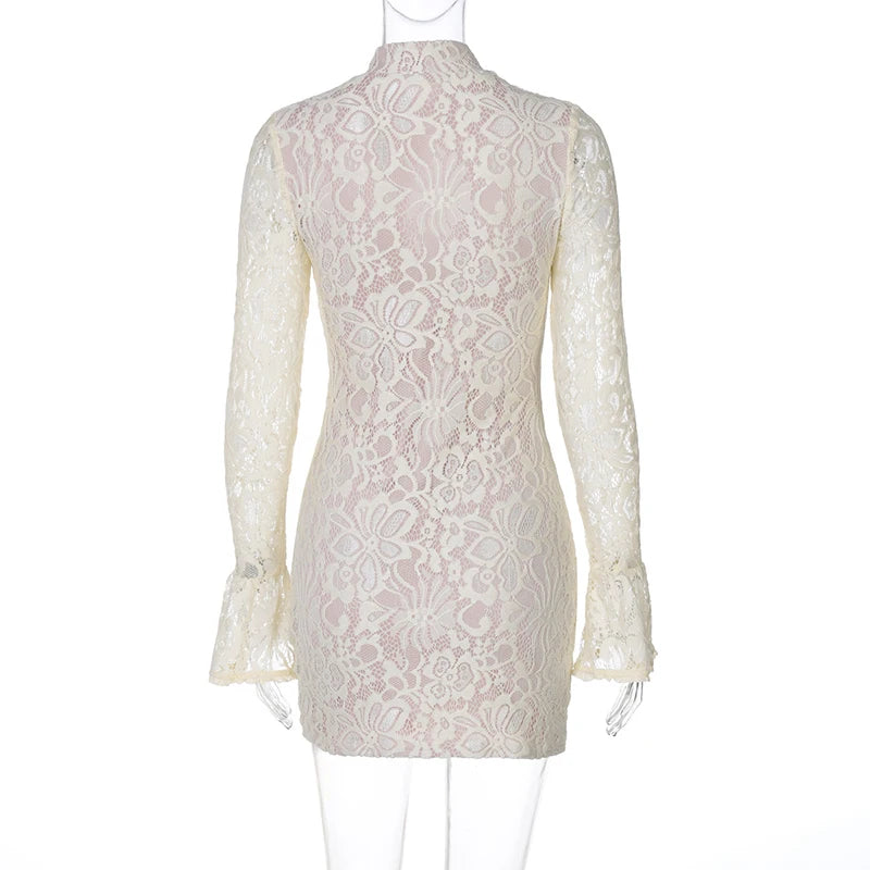 White lace dress on a mannequin against a white background