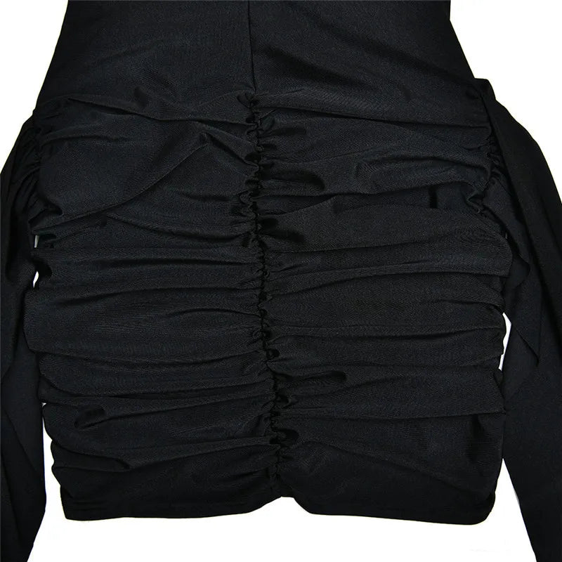 Black ruched dress on a white background