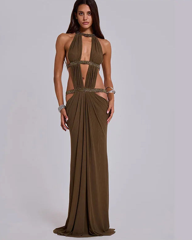 Woman wearing a brown evening gown with a plain background