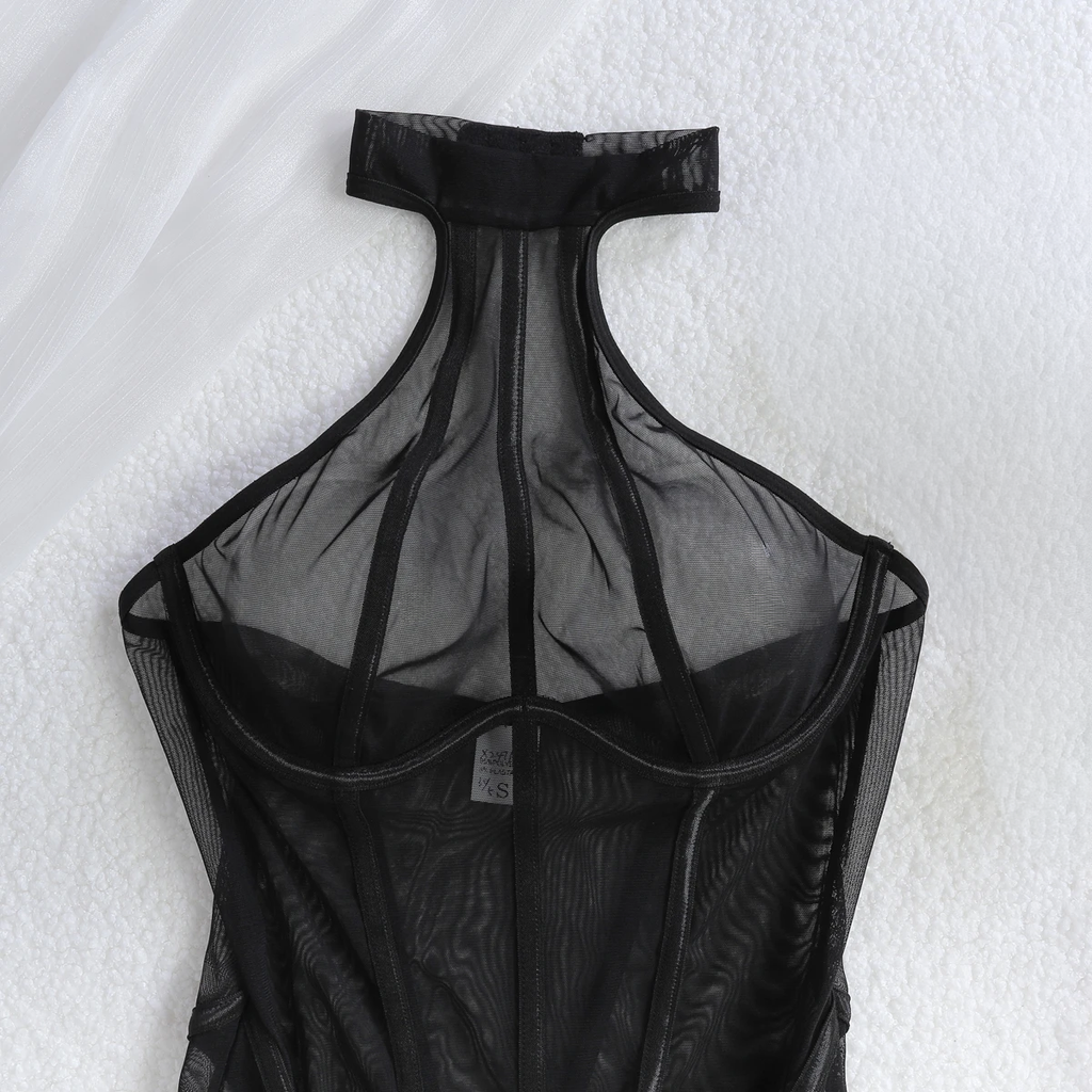 Slim bodycon jumpsuit in black mesh with halter neckline and vertical pattern
