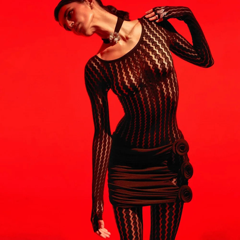 Transparent black jacquard jumpsuit featuring long sleeves and curve-fitting silhouette
