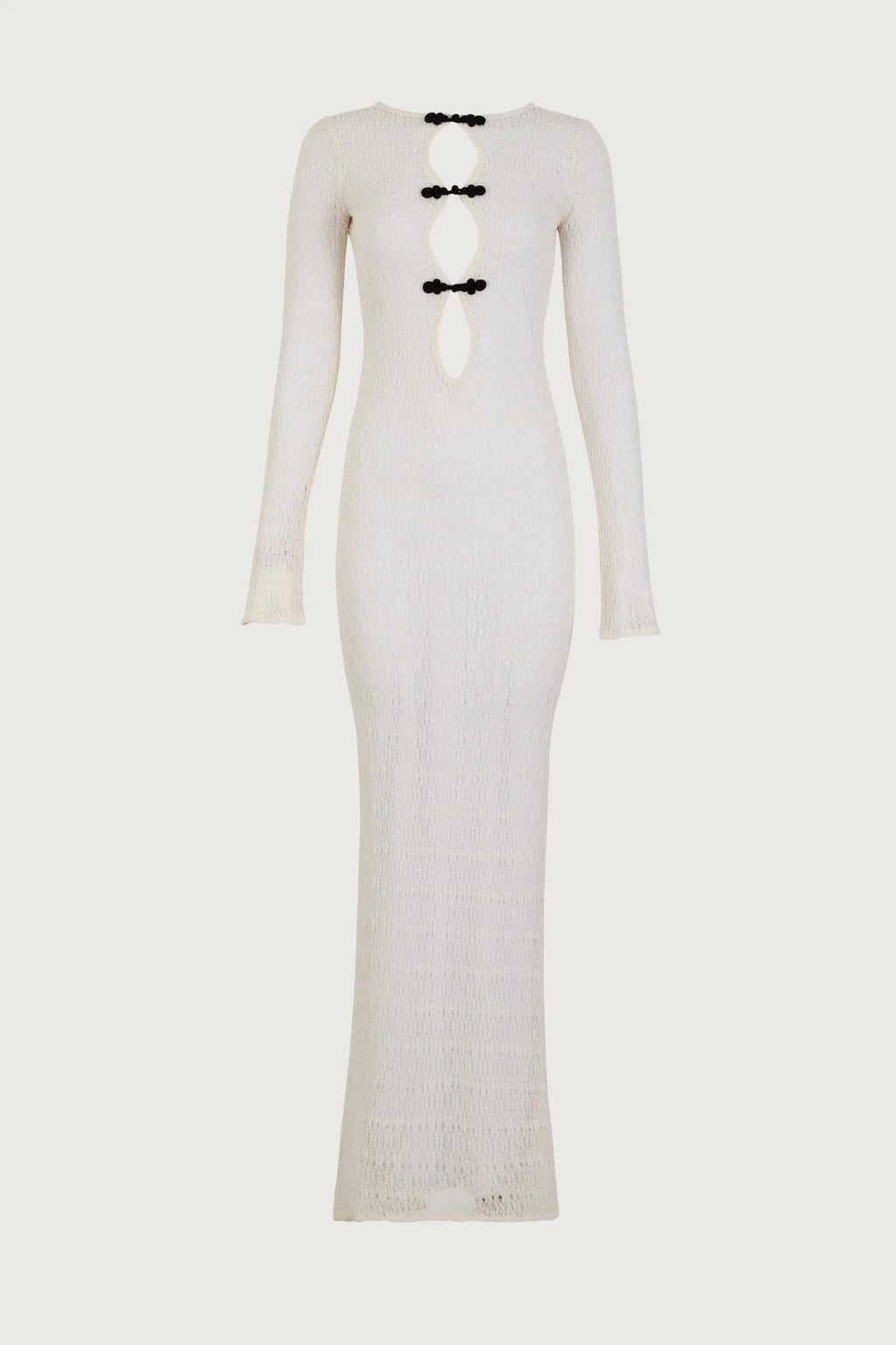 White long-sleeve dress with black accents on a white background