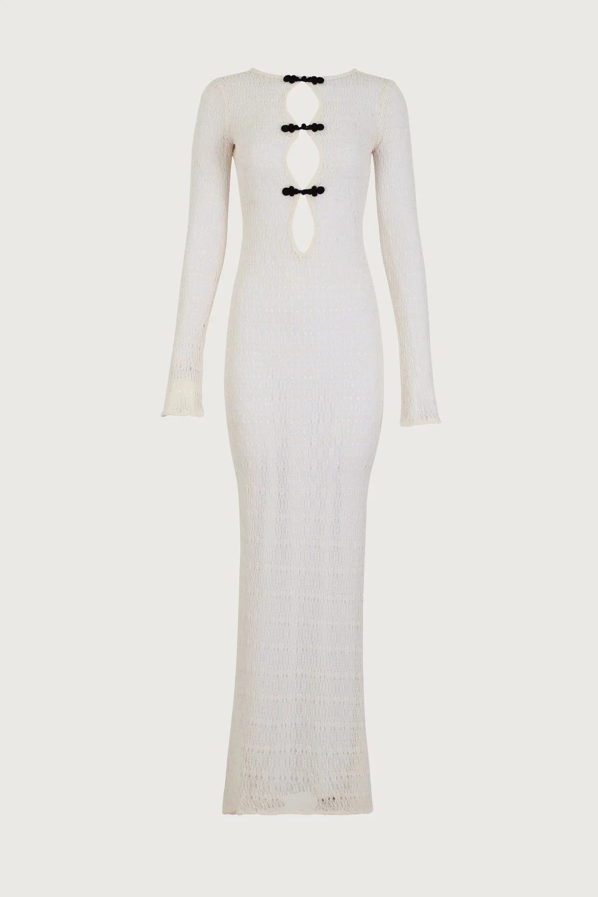 White long-sleeve dress with black accents on a white background