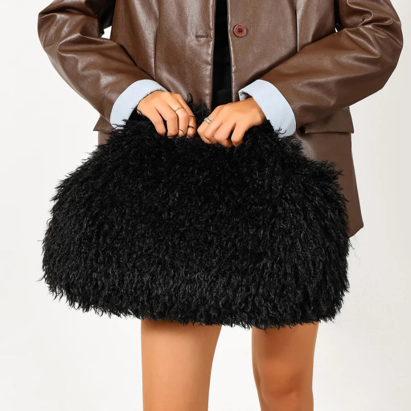 Close-up of fuzzy clutch bag with metal kiss-lock frame