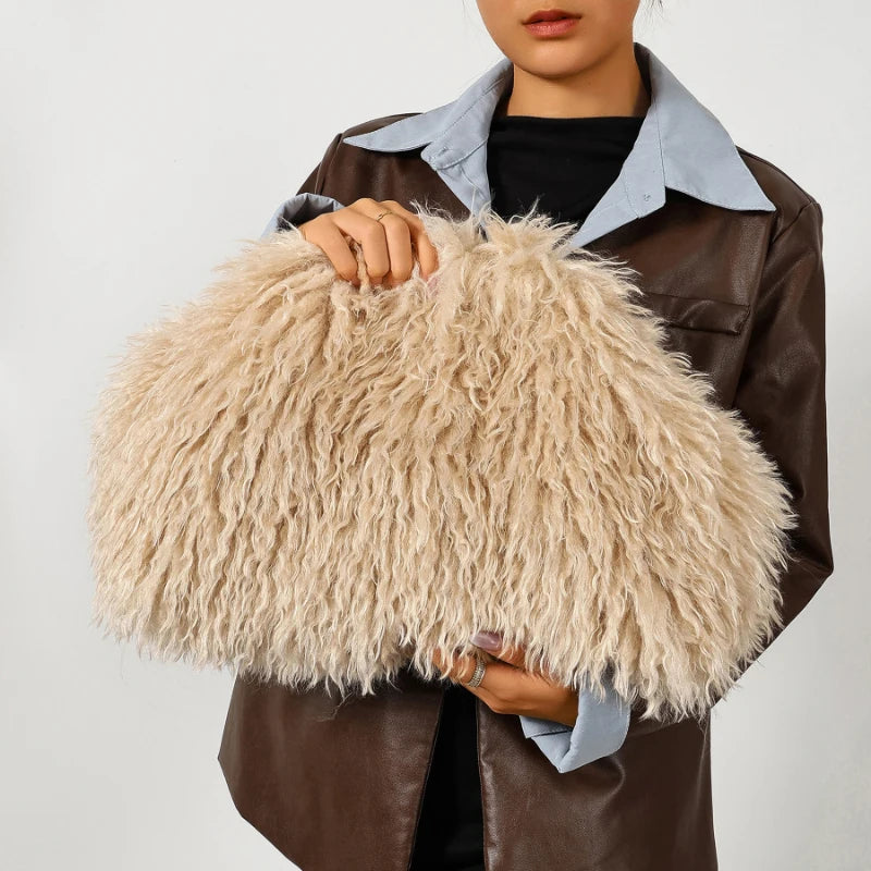 Model carrying an oversized apricot beige fuzzy clutch bag