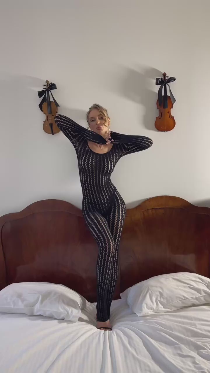 Sleek black long-sleeve mesh jumpsuit with lightweight jacquard knit and fitted shape
