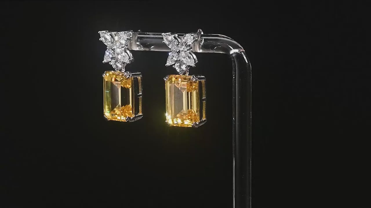 Yellow emerald cut gemstone drop earrings with sterling silver and sparkling diamond accents 